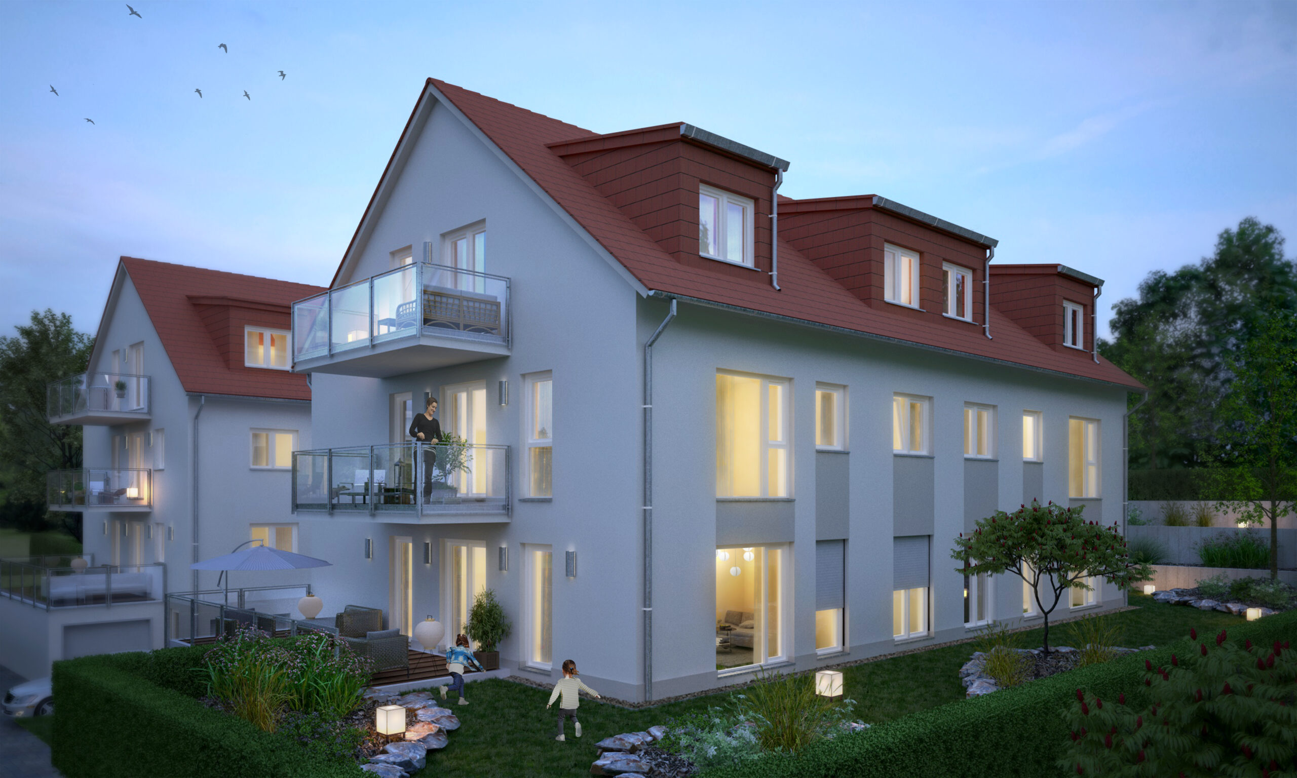 Ein Mehrfamilienhaus mit Balkonen, einer Terrasse und großem Garten