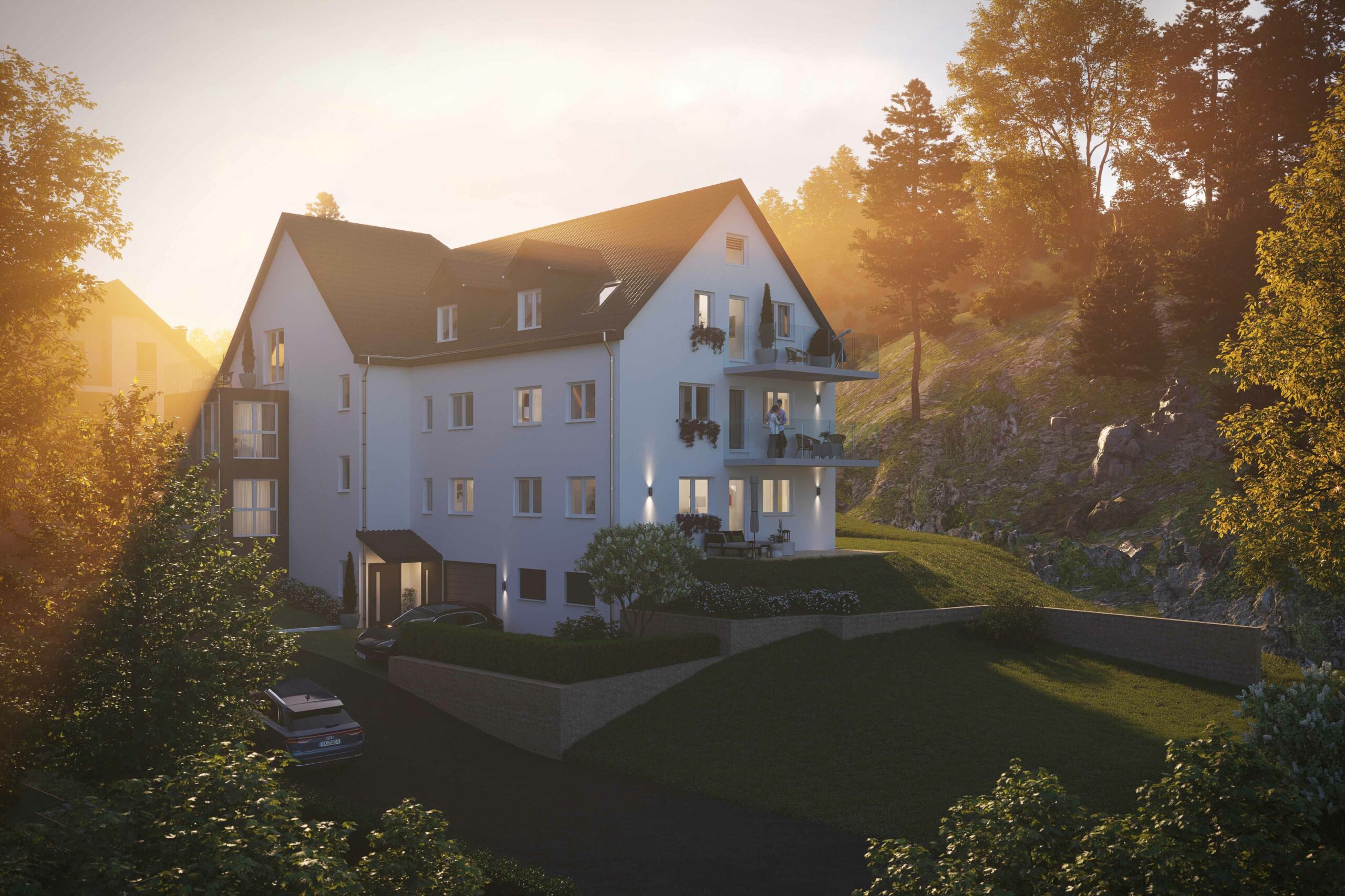 Ein Mehrfamilienhaus im Grünen mit Balkonen und großem Garten